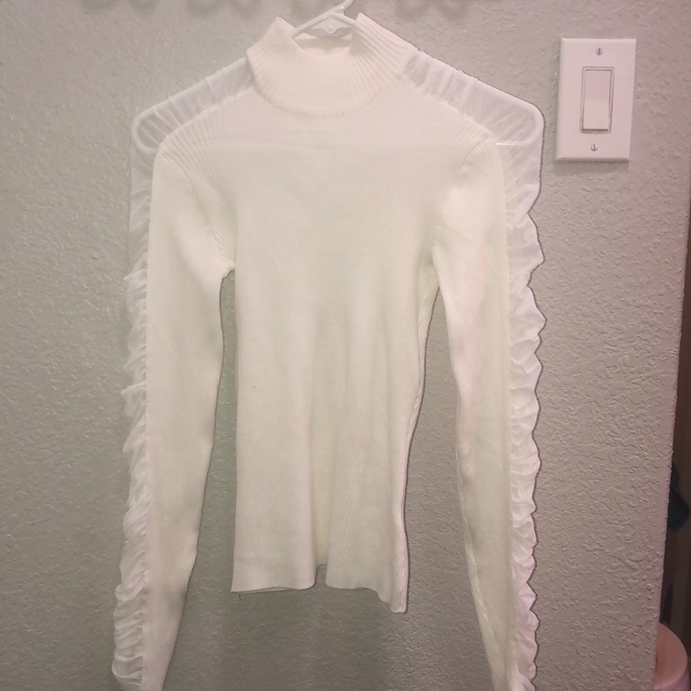 A cute long sleeve shirt with mesh arms